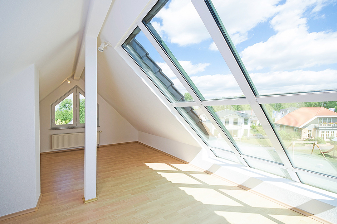Completed loft conversion with full-height roof windows