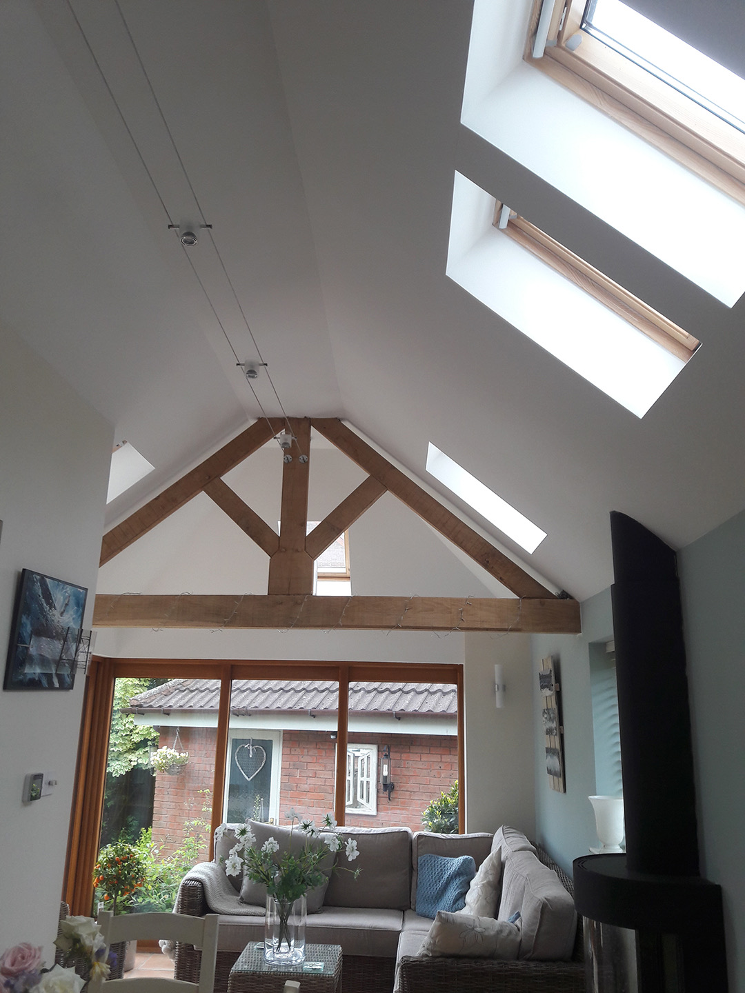 Completed vaulted home interior with roof windows