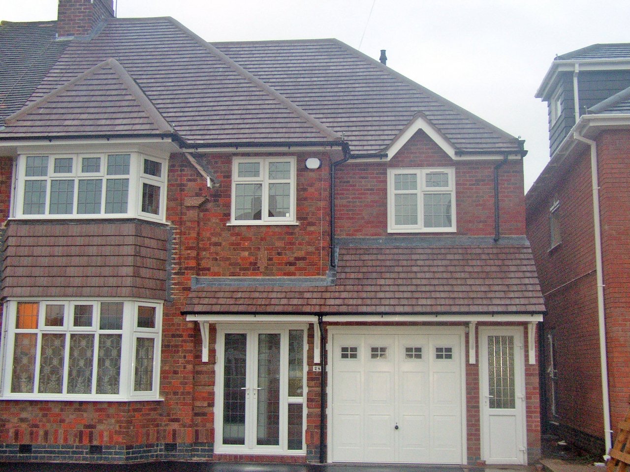 First-floor extension and tiled roof alterations